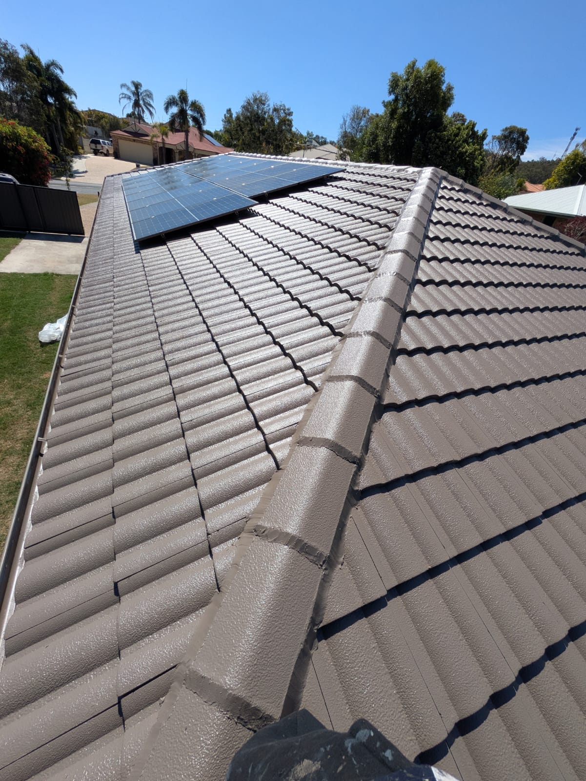 Clean gutter lines along a restored roof edge